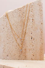 Collana doppia punto luce croce